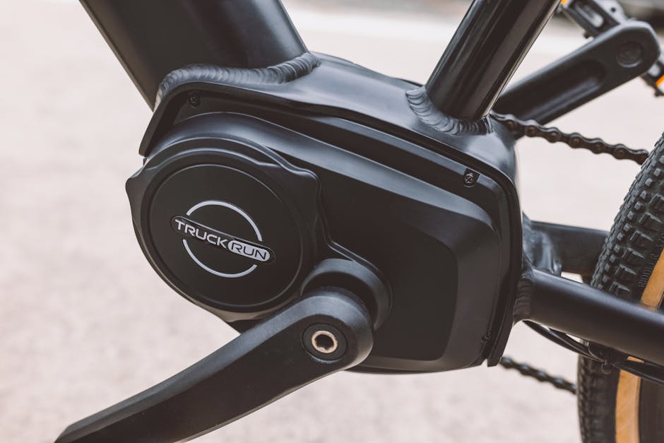 Detailed close-up image of a black electric bicycle motor and pedal system.